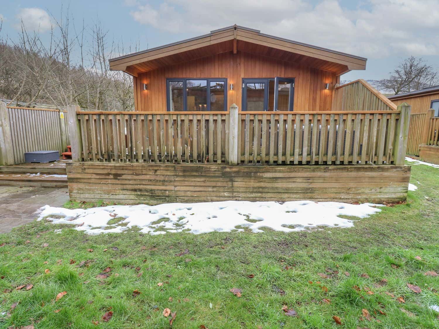 Secluded Dovestone Lodge in private position with Saddleworth Moor beyond