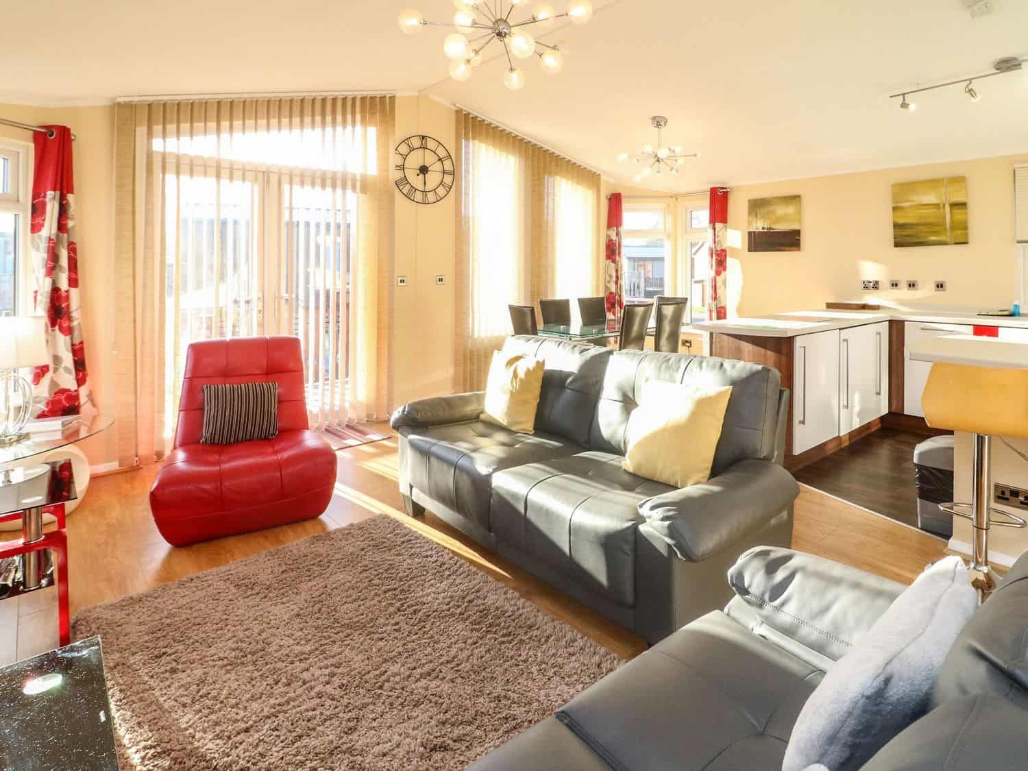 Open plan living area with comfortable seating at Dream Catcher Lodge