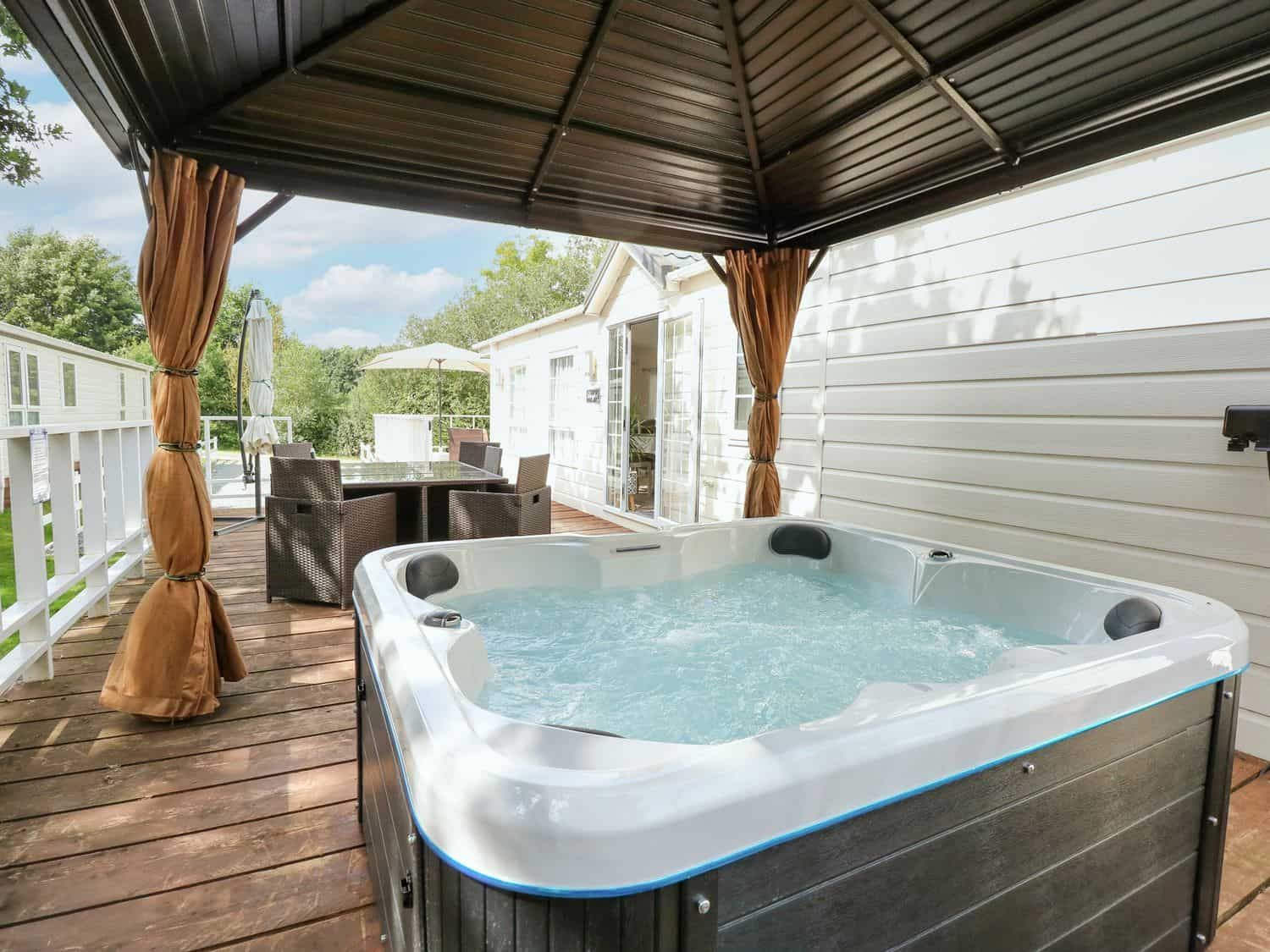 Private hot tub under covered gazebo at Lakeside View with lake views