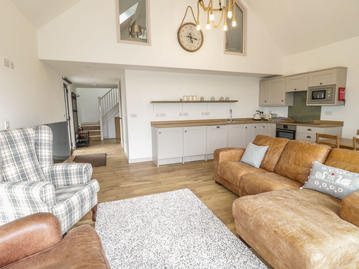Elegant interior with high ceilings and quality furnishings at Swan Lodge