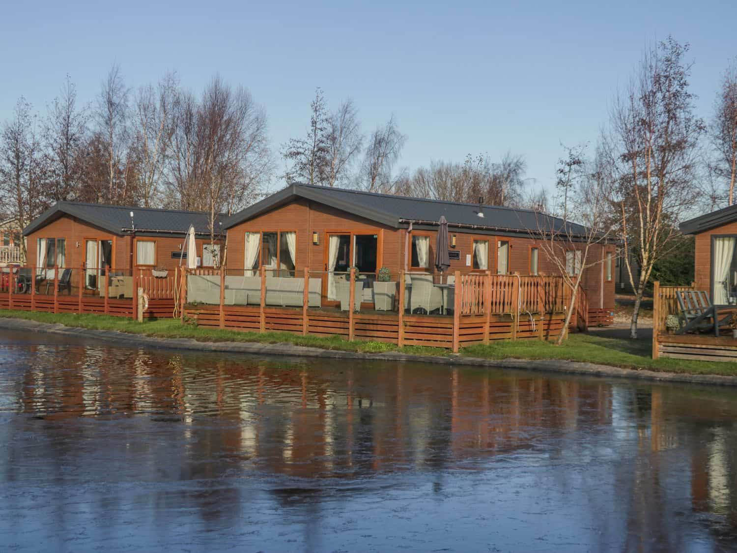 The Three Bears Lodge exterior in a peaceful setting