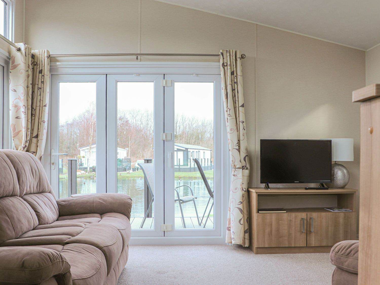 Bright and airy living space inside Tiptoes Lodge