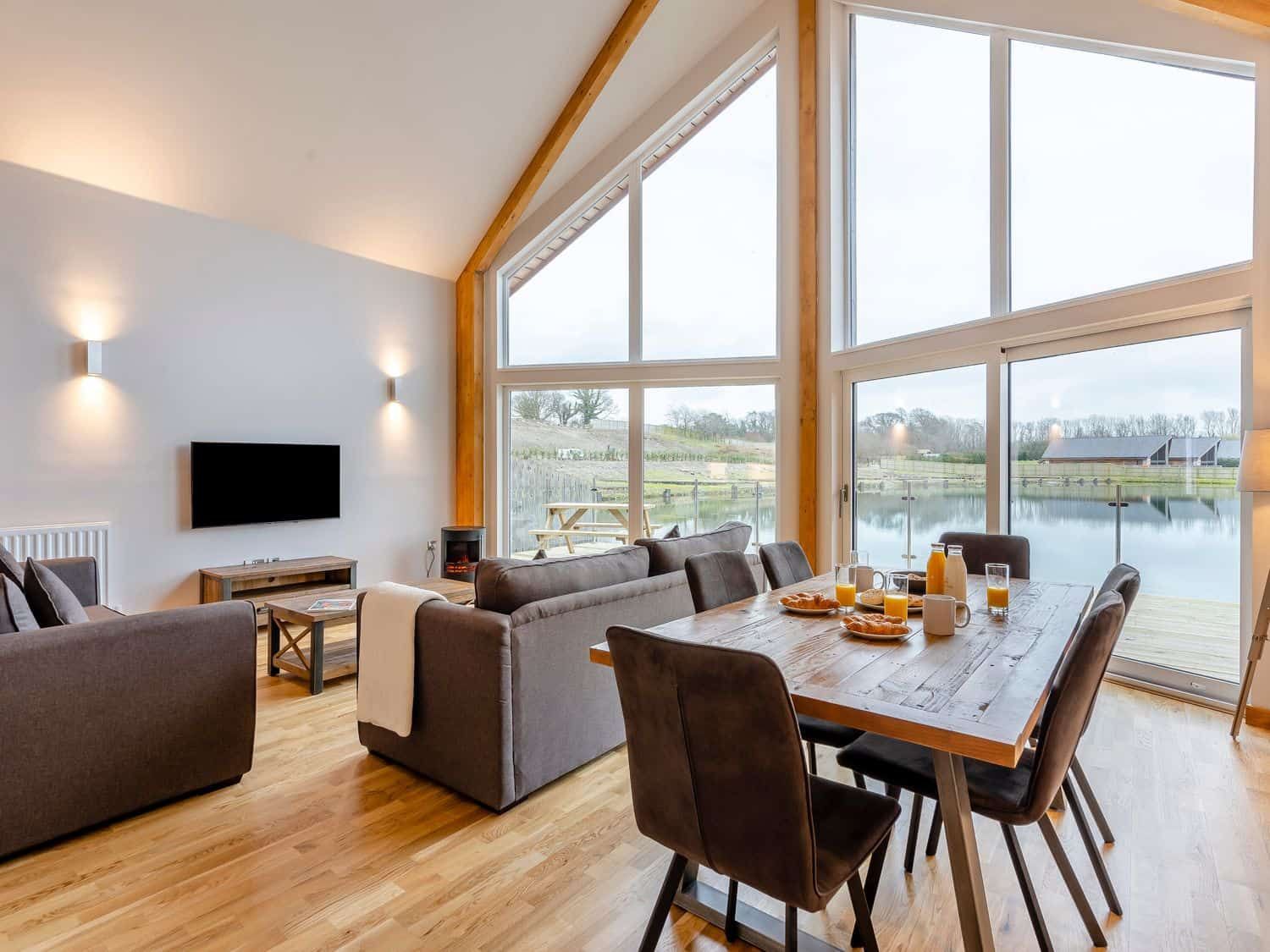 Spacious living area with dining table at Tranquillity 3 (Pet)