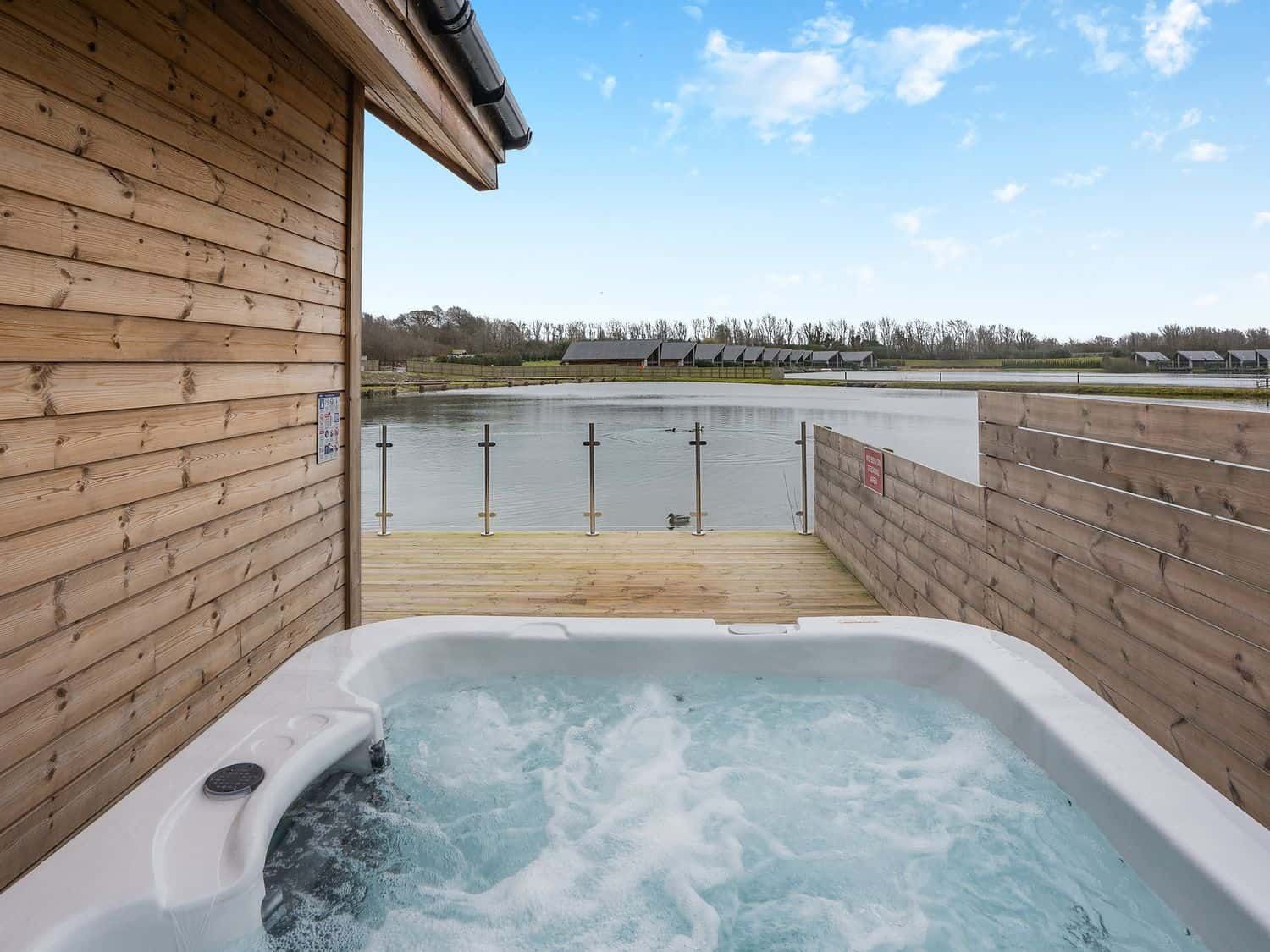 Private hot tub overlooking the lake at Tranquillity 3 (Pet)