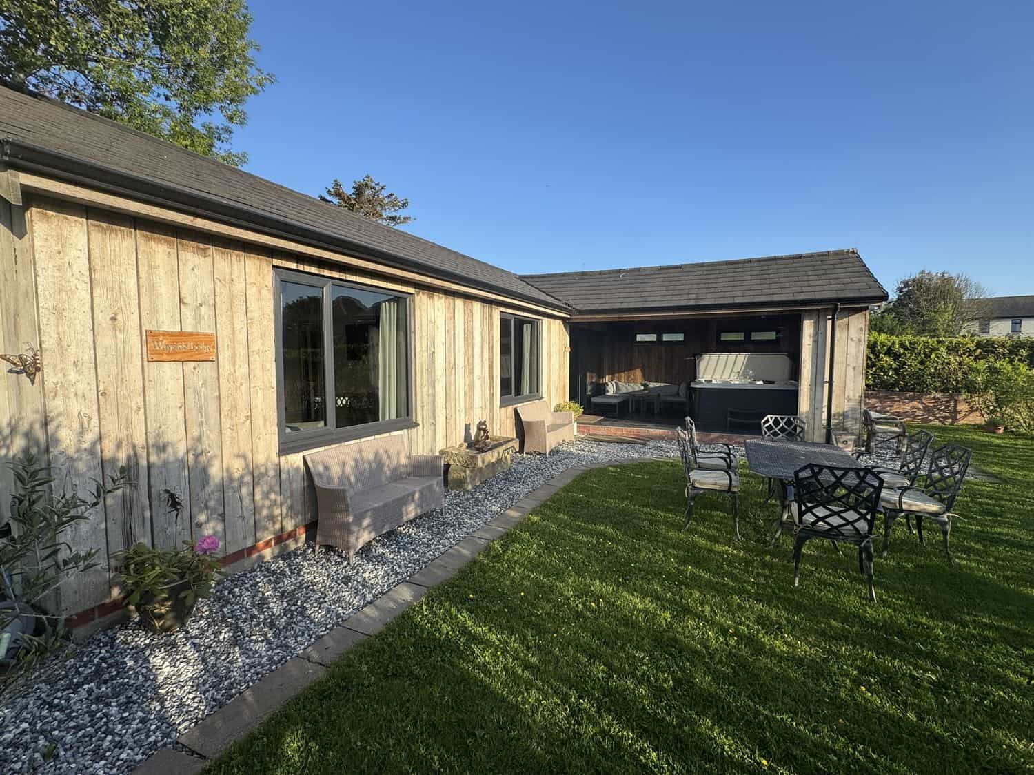 Wayside Lodge exterior with patio area