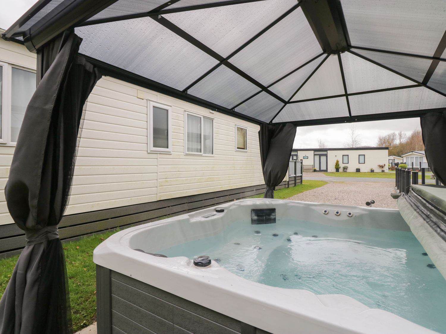 Private hot tub on the deck at Yealand 36