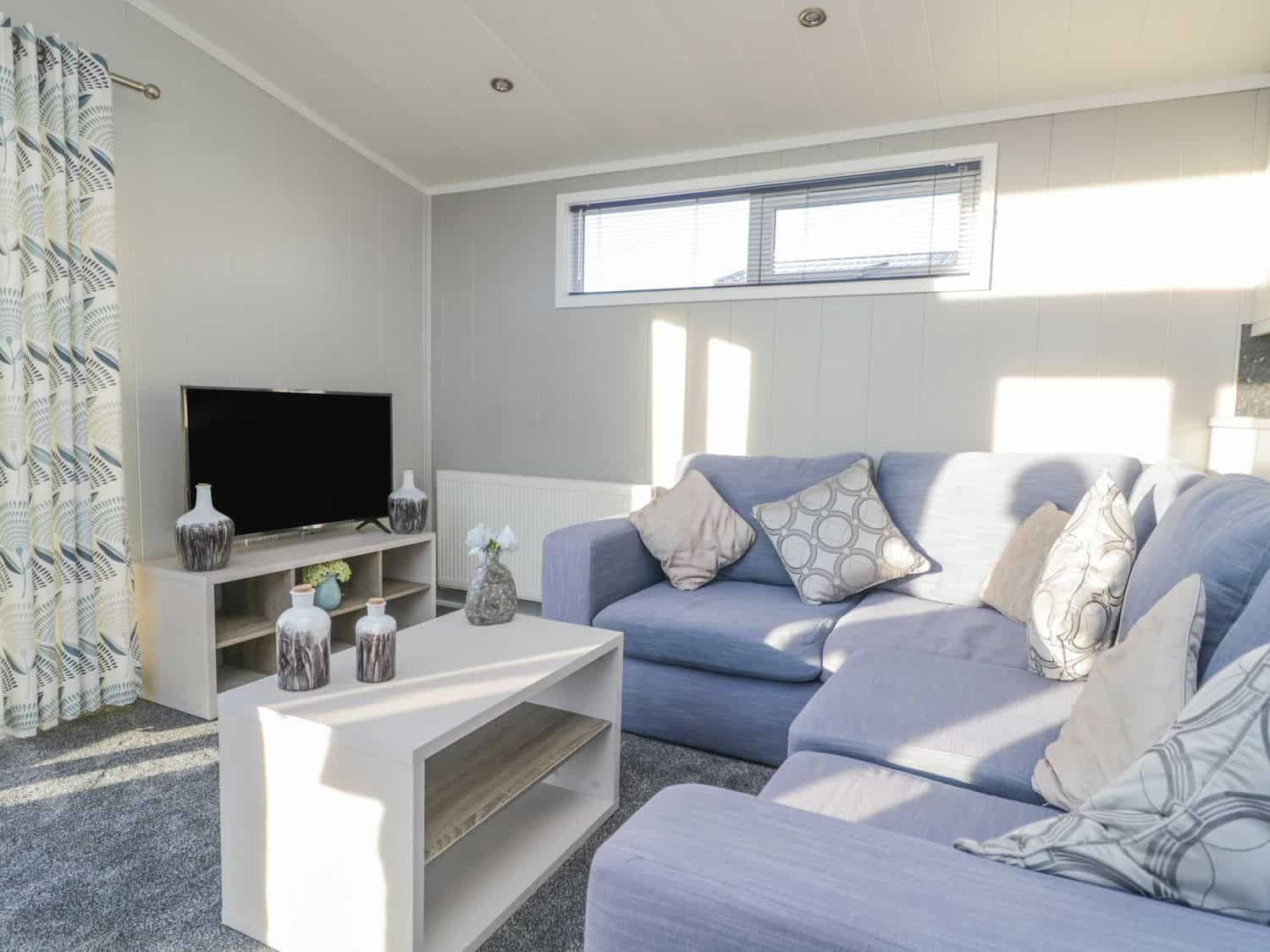 Comfortable lounge area with modern decor at Yealand 36