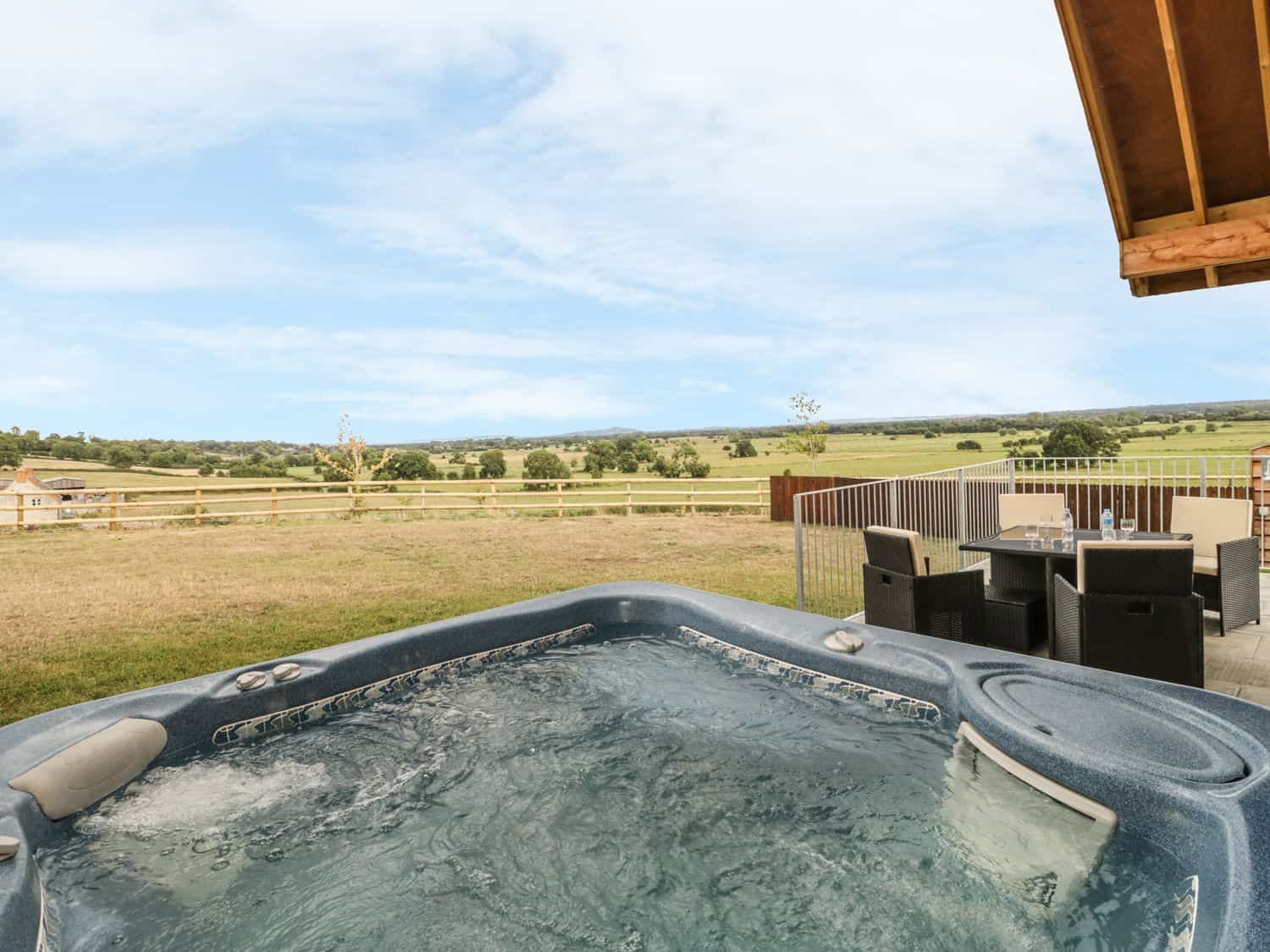 Private hot tub with rural Somerset views at Swan Lodge Castle Farm