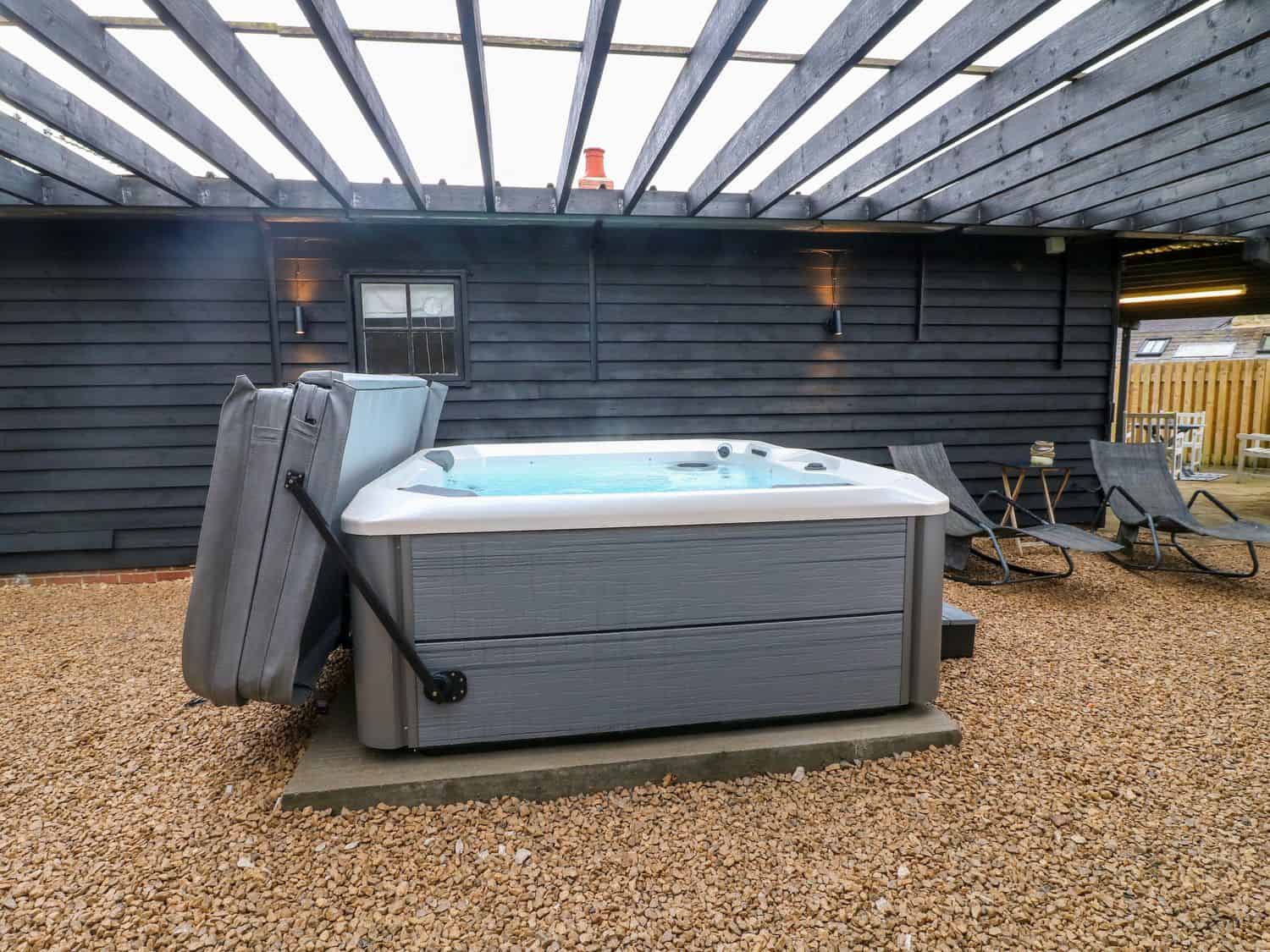 Private hot tub with countryside views at The Lodge At Wildersley Farm