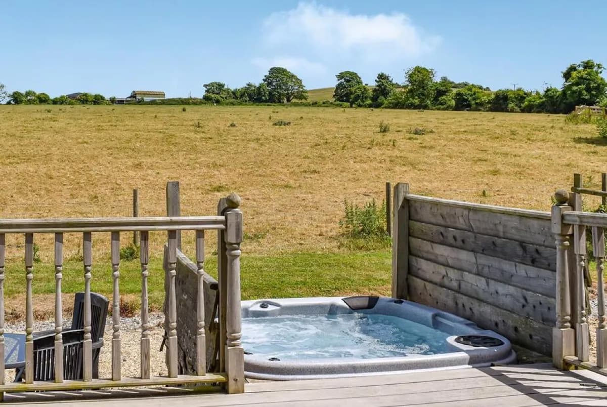 Hot tub under dark skies at Buckland Lodge