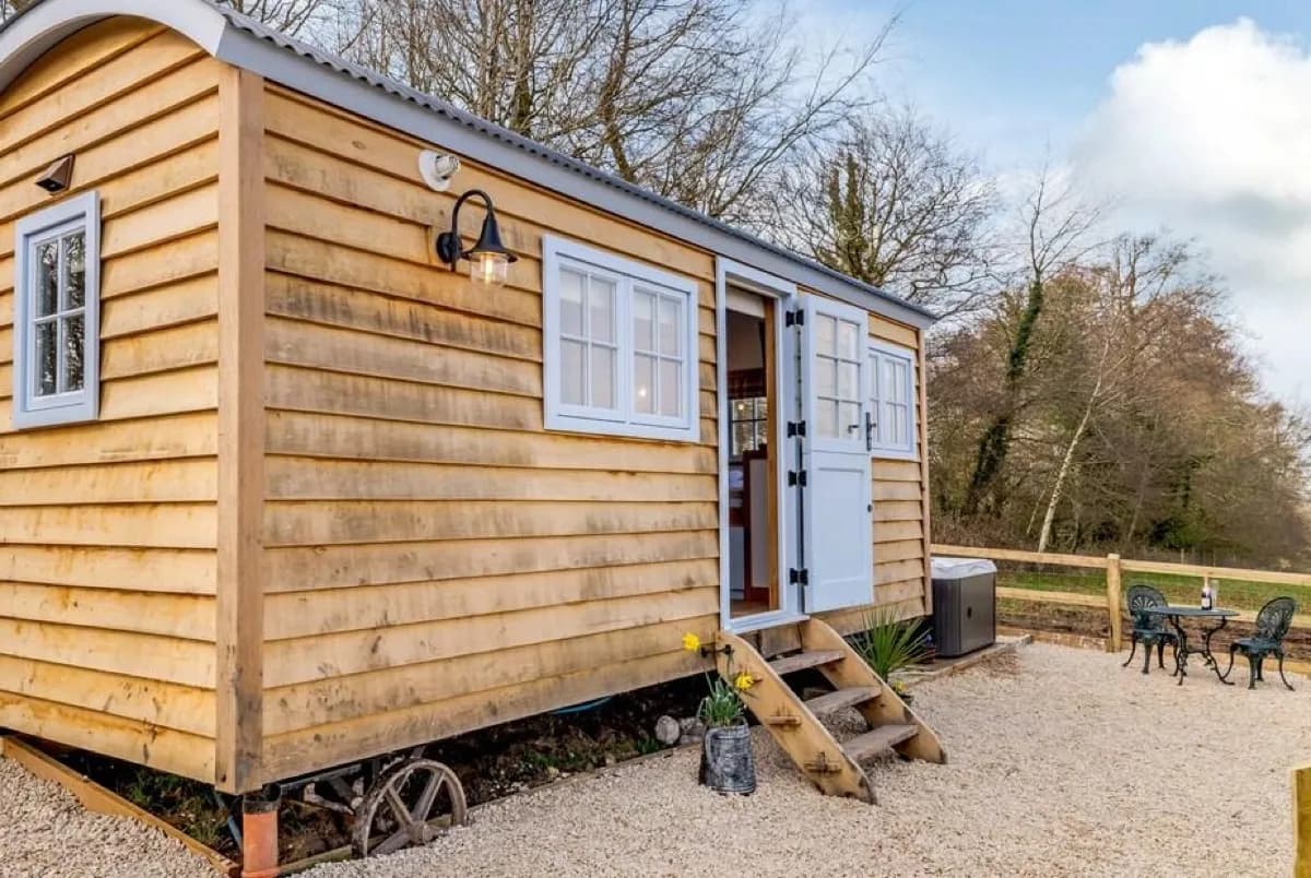 Stylishly furnished interior with woodburner at Spire View Hut